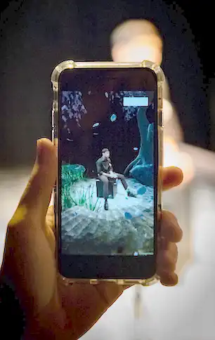 Preview of The Safet SHow showing an actor next to an XR prop of a tree.